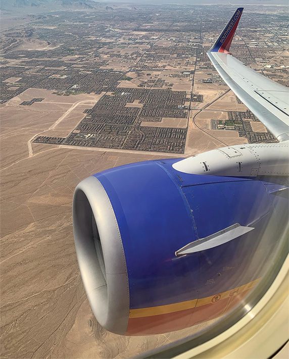 A view from an airplane of neighborhoods below