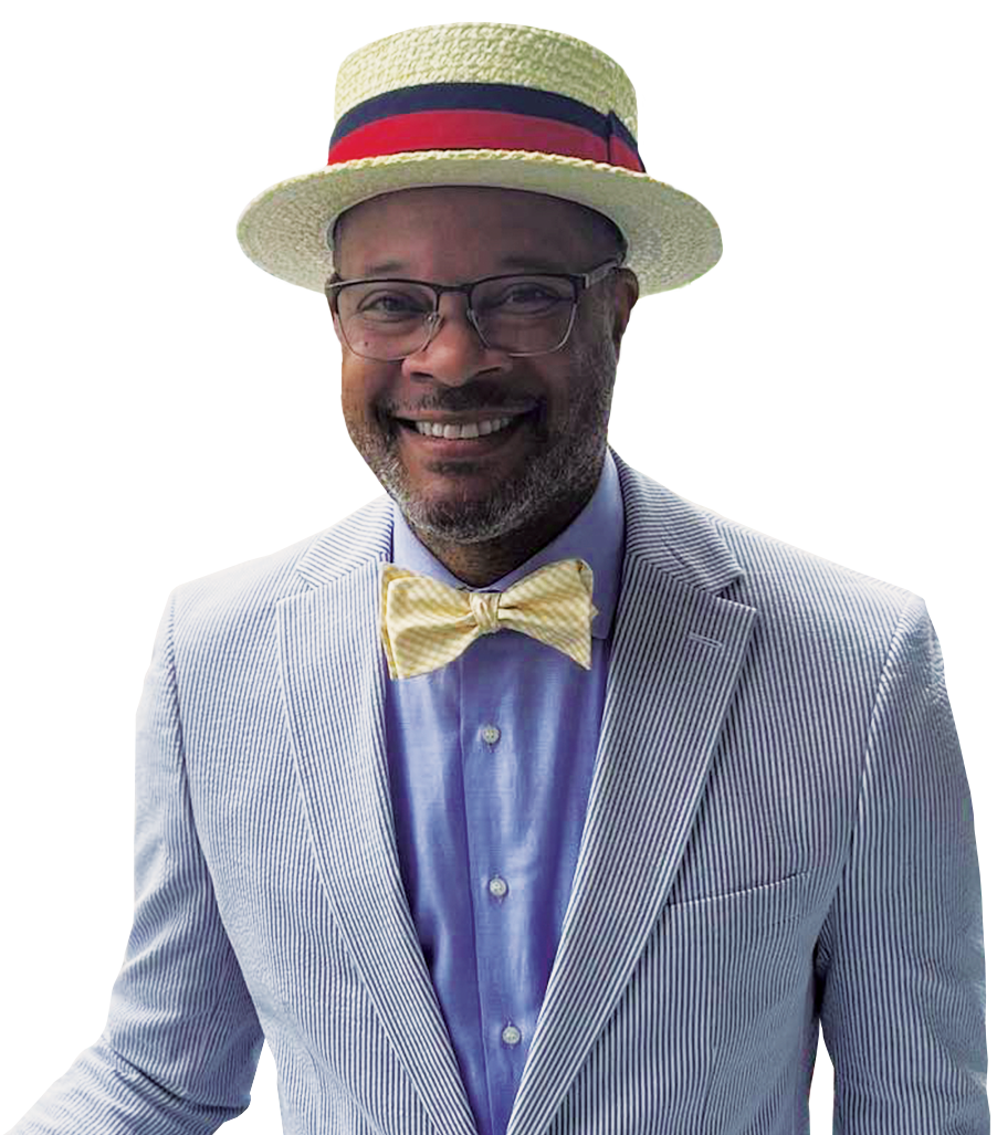 Nevada Attorney General Aaron Ford smiling in a boater and bow tie.
